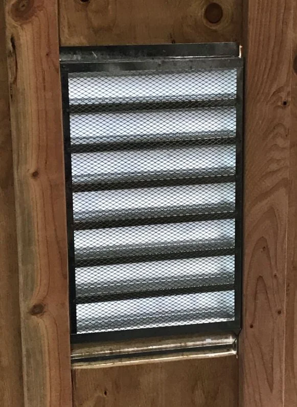 A photo of the attic fan installation from outside of the attic.