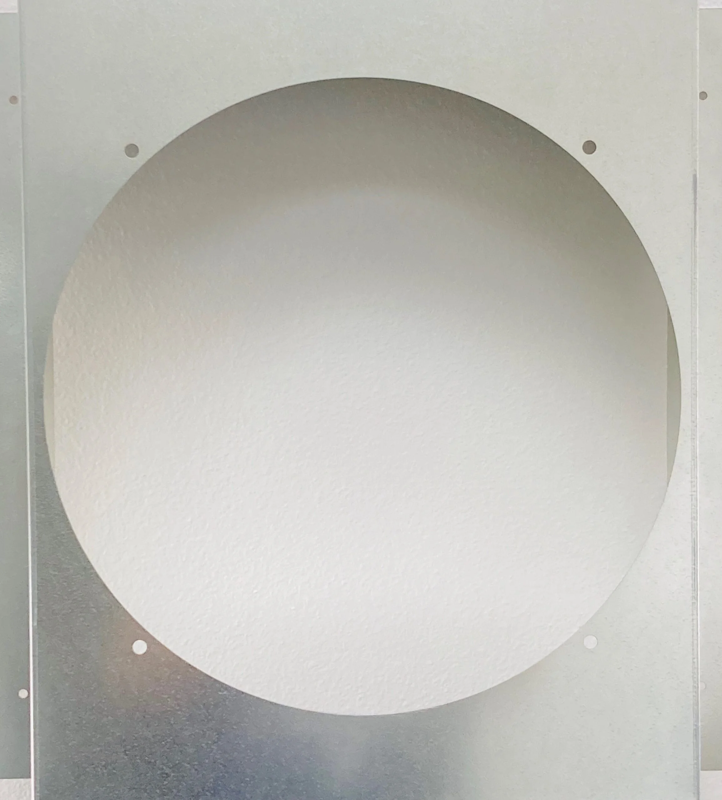 A photo of the empty housing that is used to install a Centric Air Attic Fan