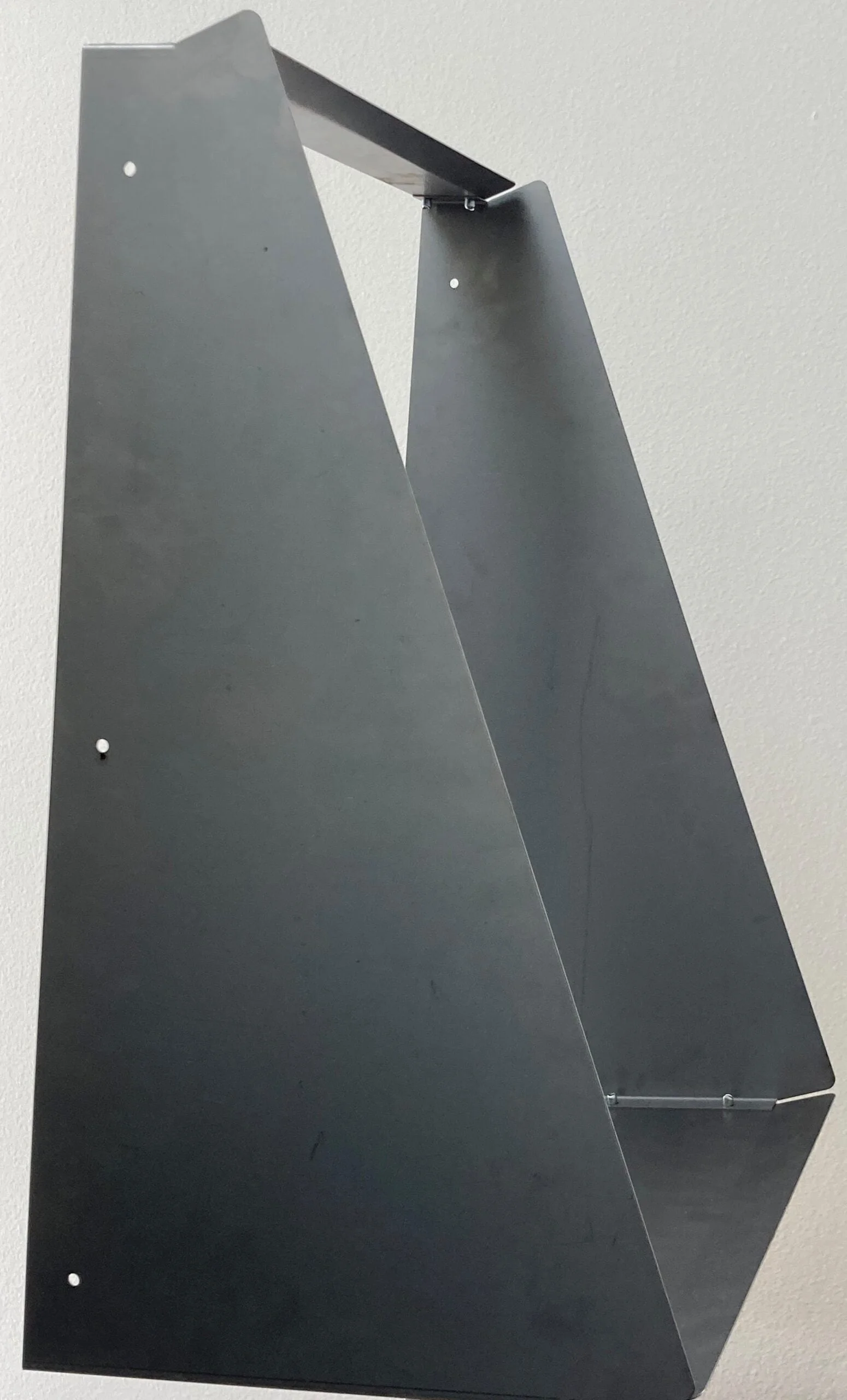 A photo of the vertical wall mount adapter.